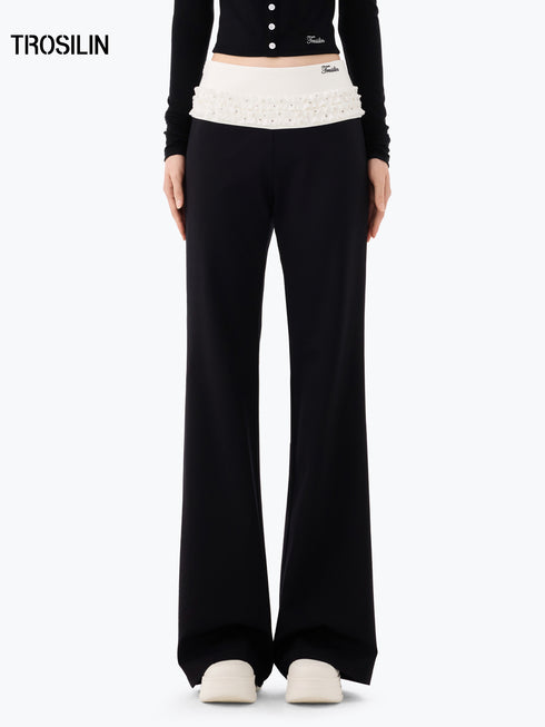DOTTED LUXE Flared Low-Waist Trousers