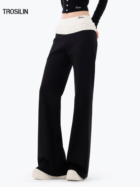 DOTTED LUXE Flared Low-Waist Trousers